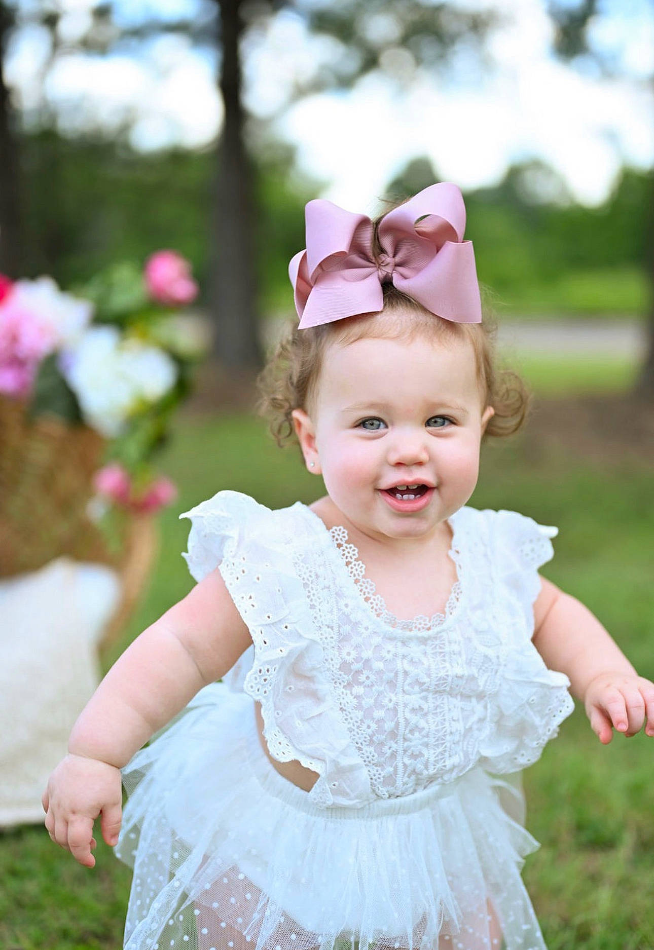 Emery is registered to the contest to win money with this photo: baby_toddler_clothing, blond, bridal_accessory, bridal_clothing, child, clothing, day_dress, embellishment, event, facial_expression, grass, happy, headpiece, joy, person, petal, photograph, pink, plant, smile