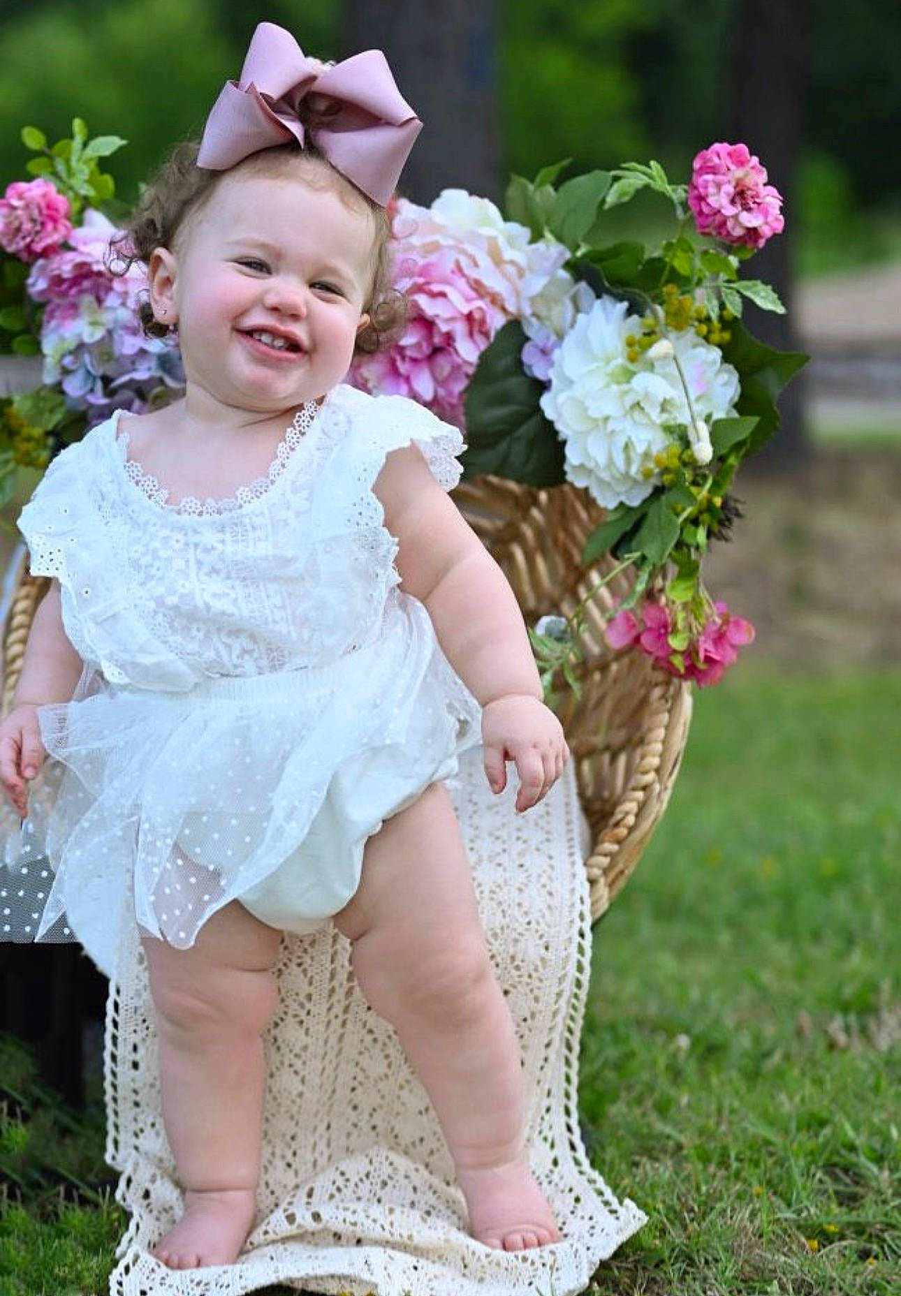 Emery is registered to the contest to win money with this photo: baby_toddler_clothing, bridal_accessory, dress, embellishment, event, flower, grass, hair_accessory, happy, headband, headgear, headpiece, joy, person, petal, pink, plant, skin, smile, textile