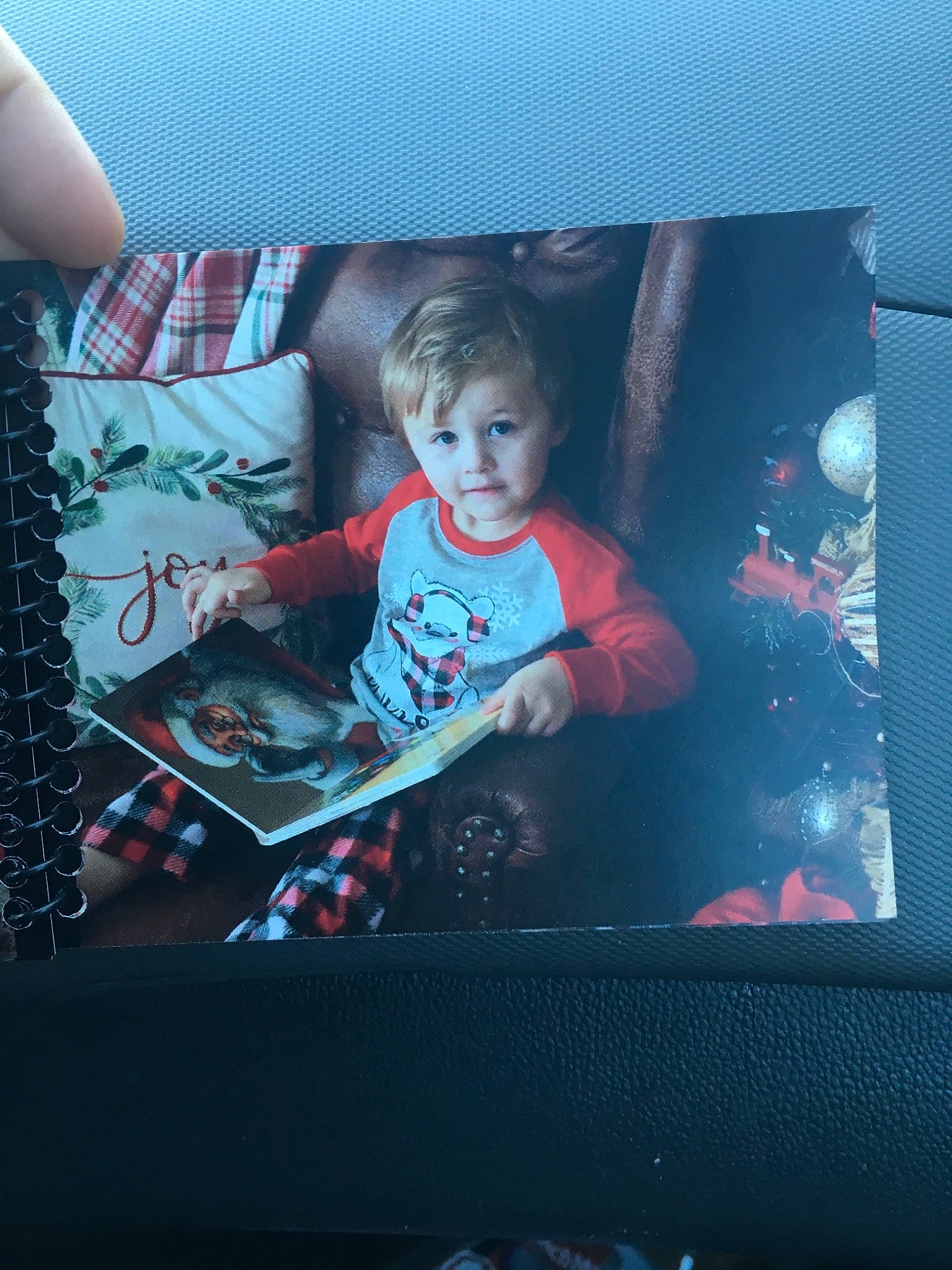 Colton is registered to the contest to win money with this photo: car, child, electronic_device, family_car, person, photography, red, room, t_shirt, technology, toddler, tree, vehicle, window