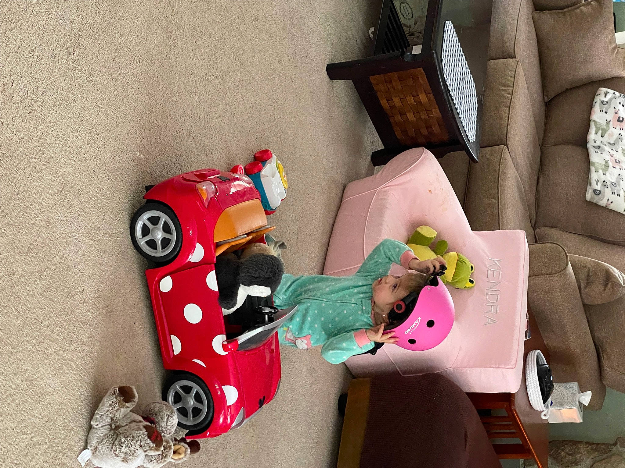 Kendra is registered to the contest to win money with this photo: automotive_design, car, child, comfort, couch, flooring, house, magenta, person, pillow, room, sofa_bed, studio_couch, textile, tire, toddler, toy, tree, vehicle, wheel