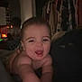 Waylon is registered to the contest to win money with this photo: baby, child, smiling, indoor, person, clothing, room, computer, dark, happy, face, arm, furniture, curtains, blanket, desk, technology, human, infant, home