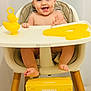 baby, box, child, cute, expression, footrest, happy, high_chair, indoor, infant, mimosa, number_four, person, playful, rubber_duck, season, seated, smiling, toy, yellow
