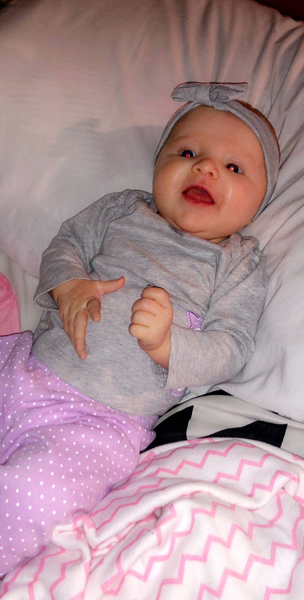 Payslee is registered to the contest to win money with this photo: baby_products, bed, bedtime, cheek, child, day, eye, girl, head, human_hair_color, infant, leg, nose, person, pink, product, purple, sitting, skin, textile