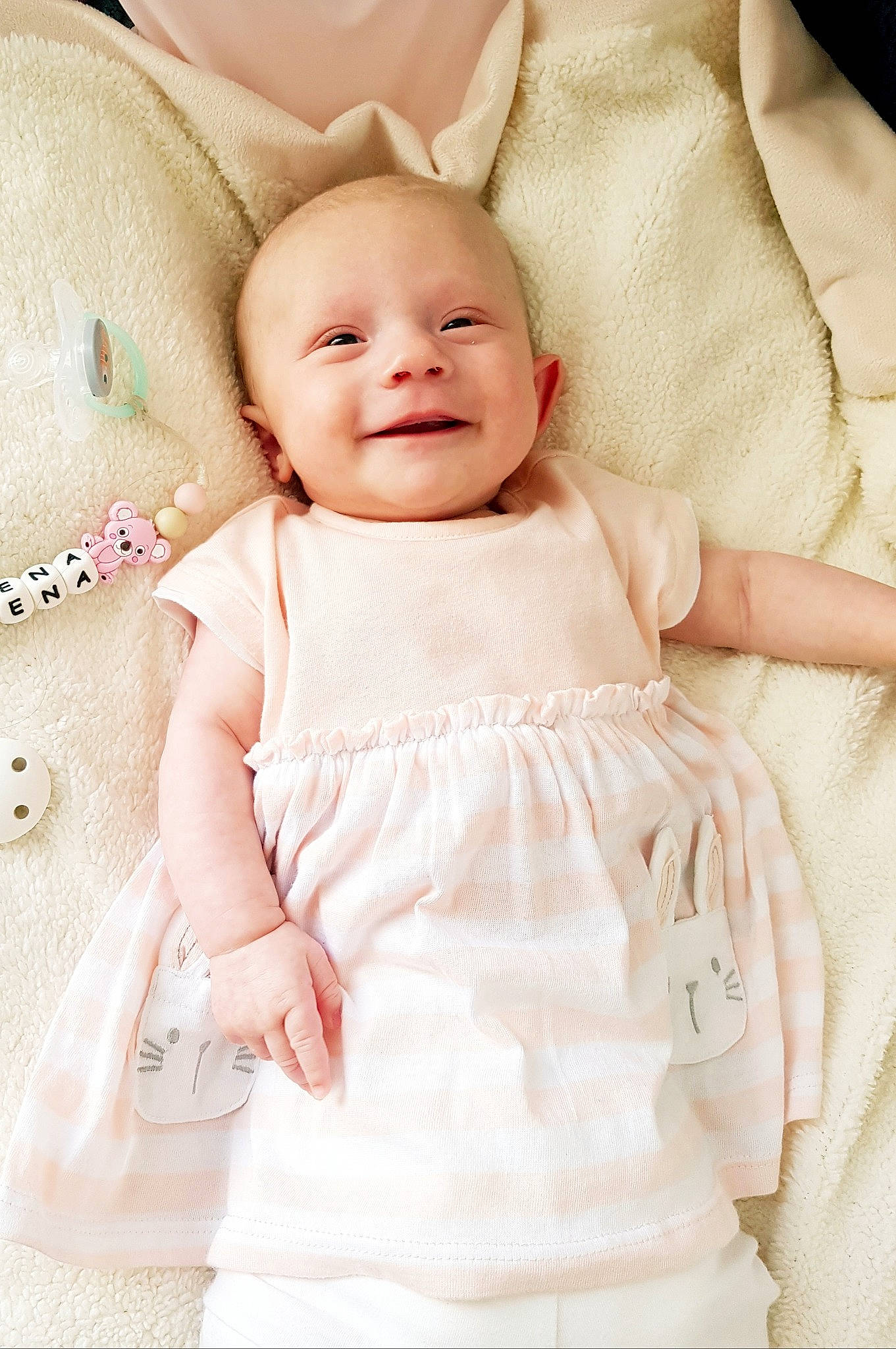 Maena participe au concours pour gagner de l'argent avec cette photo : baby, baby_toddler_clothing, child, collar, dress, embellishment, event, happy, joy, magenta, one_piece_garment, pattern, peach, person, pink, product, skin, sleeve, smile, textile