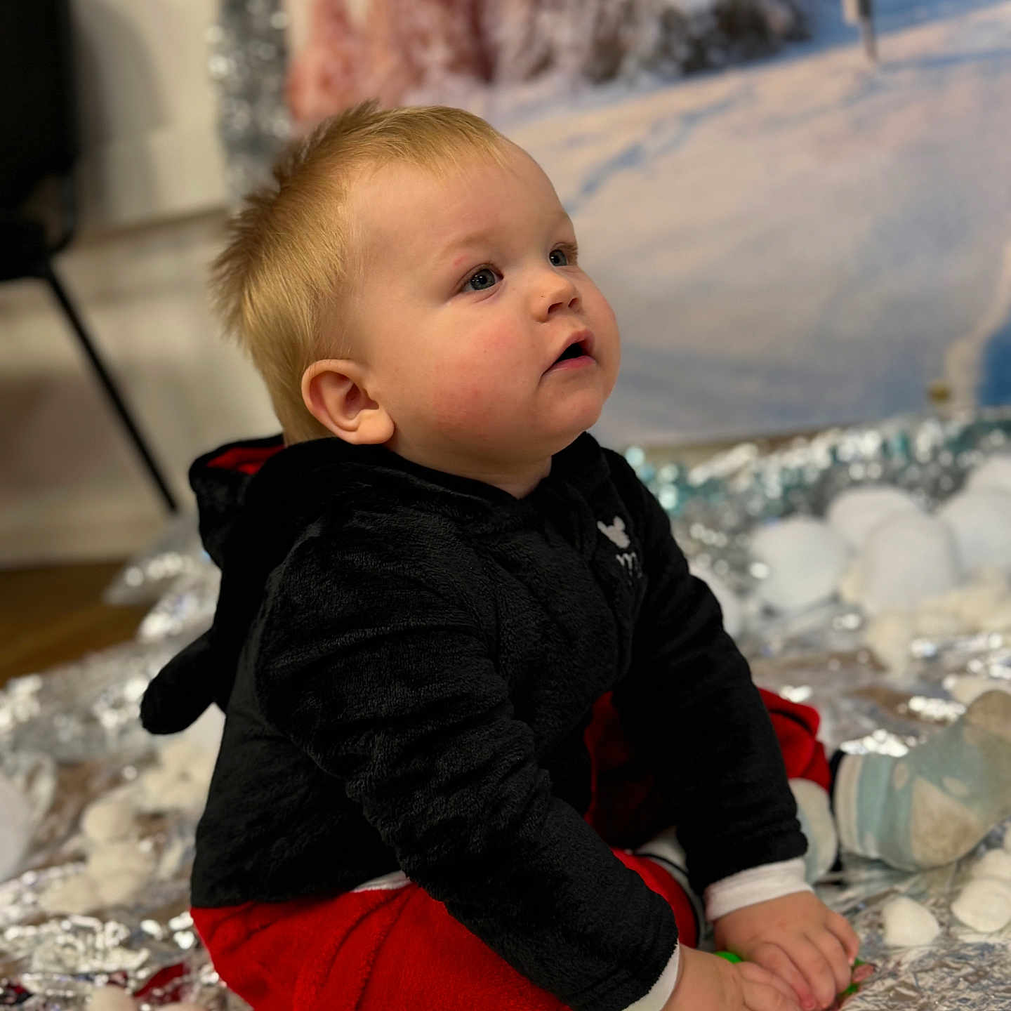 Emetas is registered to the contest to win money with this photo: baby, bodypart, clothing, face, finger, food, hand, happy, head, knitwear, longsleeve, pants, person, photography, portrait, sitting, sleeve, sweater, sweets, wood