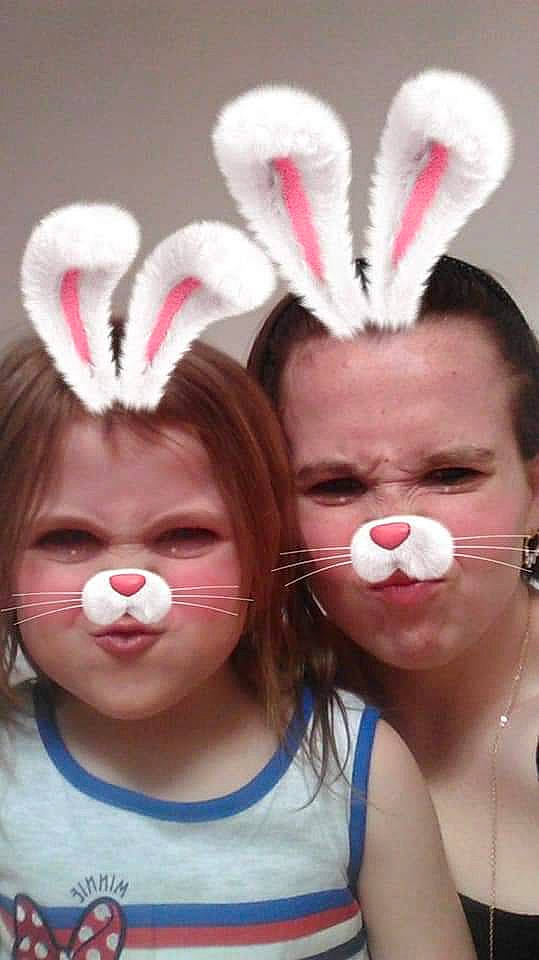 Cassandra is registered to the contest to win money with this photo: ear, easter_bunny, face, head, holiday, nose, person, pink, rabbits_and_hares, smile