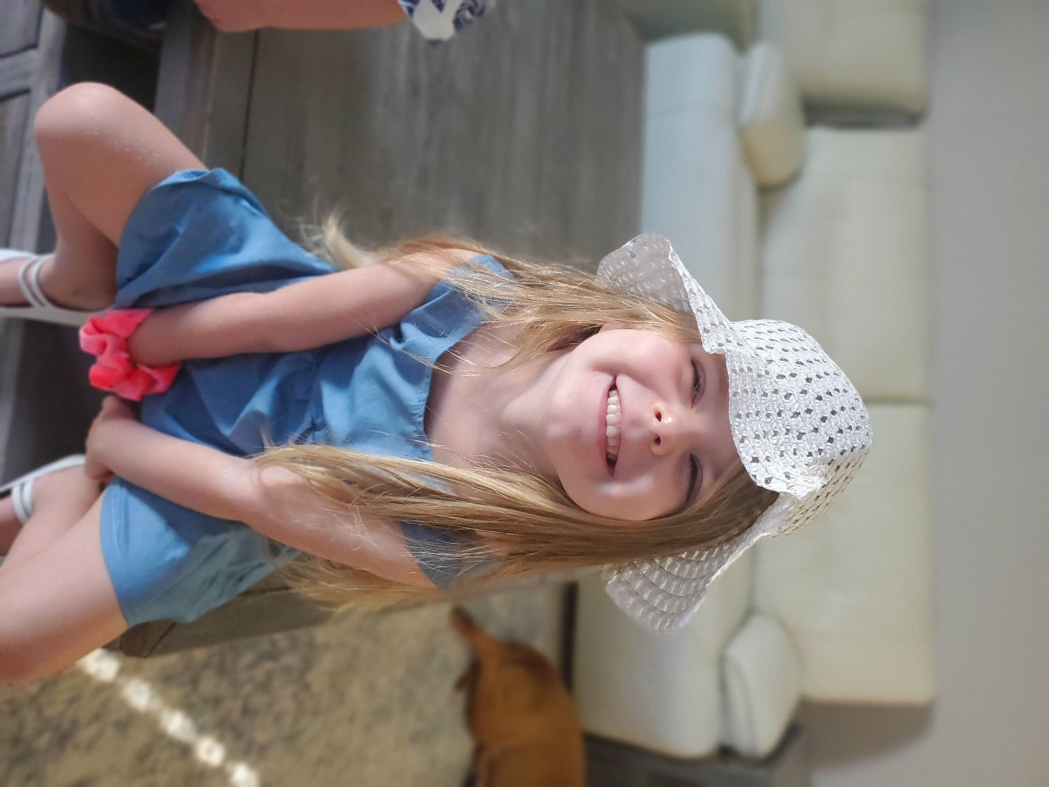 Noelle joined the competition — help win amazing prizes! blond, child, fashion_accessory, fun, happy, hat, headwear, human_leg, joy, leisure, person, portrait_photography, shorts, smile, street_fashion, thigh, toddler, vacation, window