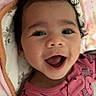 Melody is registered to the contest to win money with this photo: baby, smiling, curly_hair, pink_blanket, cute_outfit, infant, happy, face, portrait, lying_down, child, indoors, cozy, cheerful, clothing, closeup, person, expression, cute, adorable