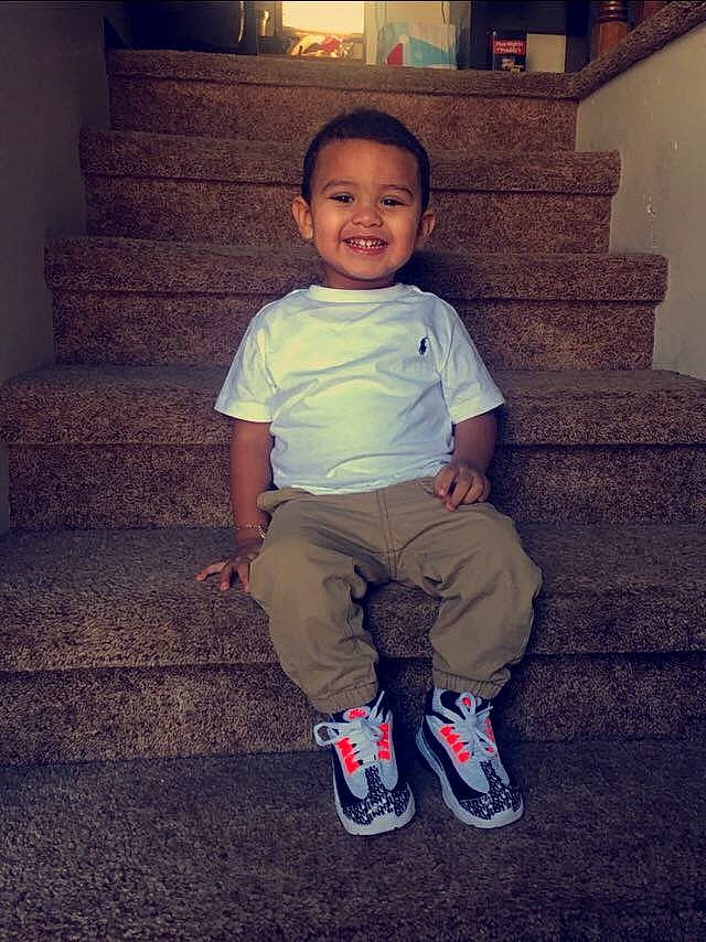 Alessio is registered to the contest to win money with this photo: cheek, child, cool, footwear, fun, happy, head, joy, leg, person, shoe, sitting, smile, snapshot, standing, toddler