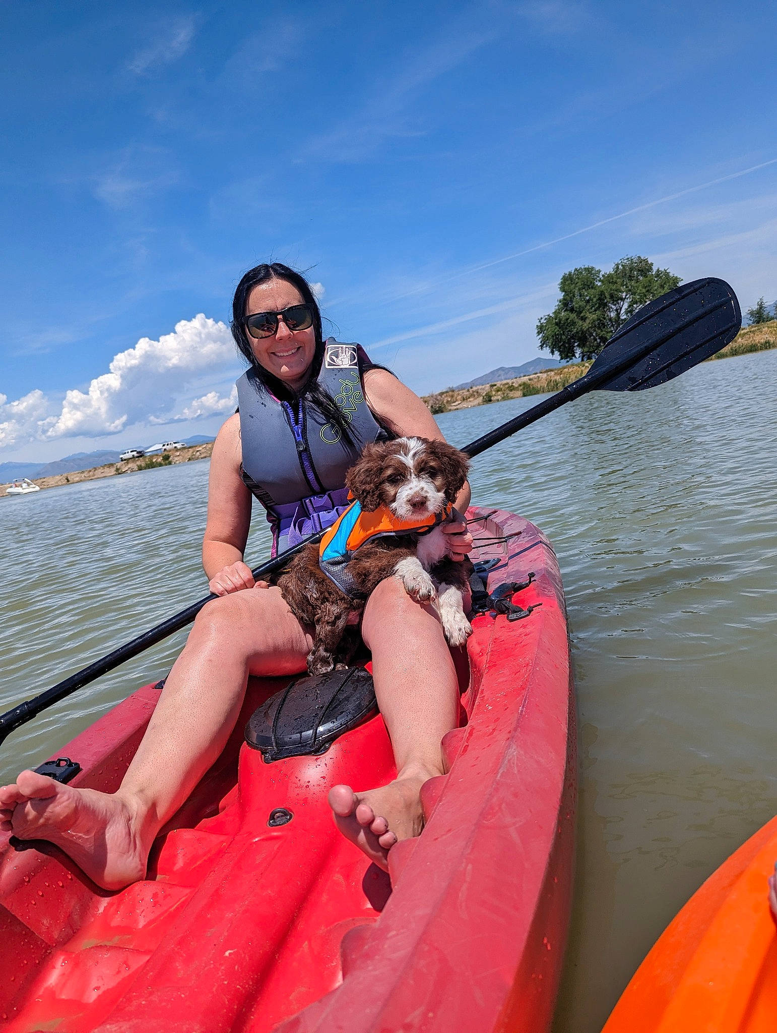 Rubble is registered to the contest to win money with this photo: boat, boats_and_boating_equipment_and_supplies, cloud, fun, lake, leisure, lifejacket, oar, paddle, personal_protective_equipment, recreation, shorts, sky, smile, sports, sports_equipment, tree, vehicle, water, watercraft
