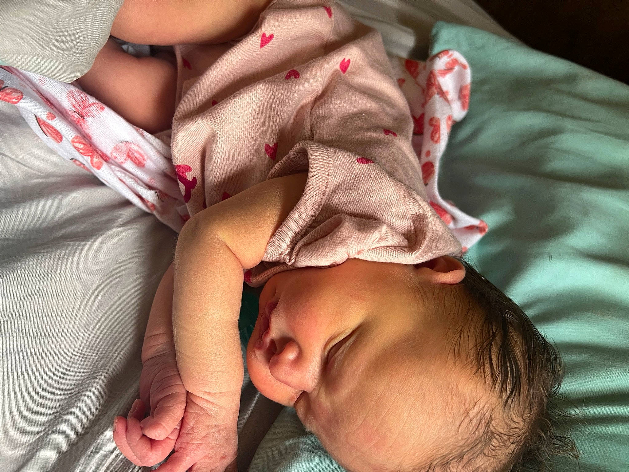 Grace is registered to the contest to win money with this photo: baby, cheek, comfort, eyelash, finger, gesture, hand, happy, joint, lip, mouth, nail, neck, nose, person, pink, red, skin, textile, thumb