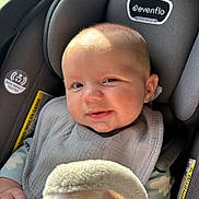 Cohen joined the competition — help win amazing prizes! baby, car_seat, evenflo, blanket, bib, infant, child, smile, happy, clothing, fabric, head, face, person, seatbelt, indoor, closeup, cute, skin, light