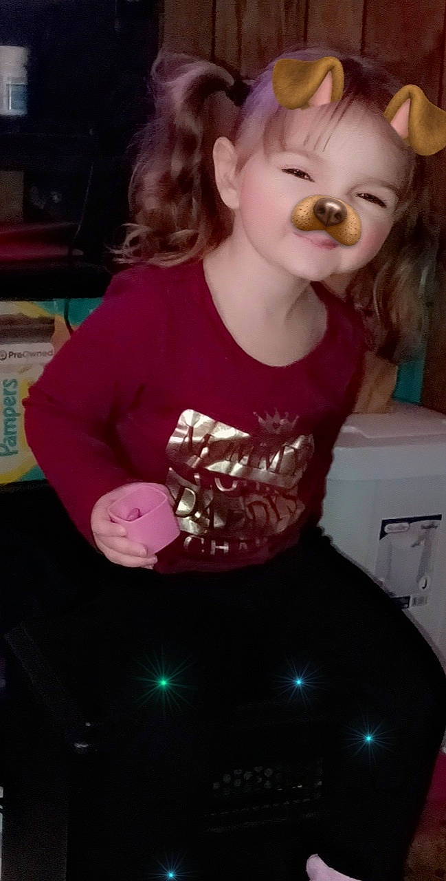 Kyra is registered to the contest to win money with this photo: baby_toddler_clothing, blond, brown_hair, cheek, child, cool, eyelash, fun, happy, human_body, lip, long_hair, magenta, mouth, pattern, person, pink, sleeve, t_shirt, toddler