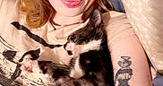 Mittens joined the competition — help win amazing prizes! animal, bed, casual, cat, closeup, comfort, cuddling, cute, face, hair, indoor, kitten, peace_sign, person, pillow, relaxing, skin, sleeping, tattoo, young_adult
