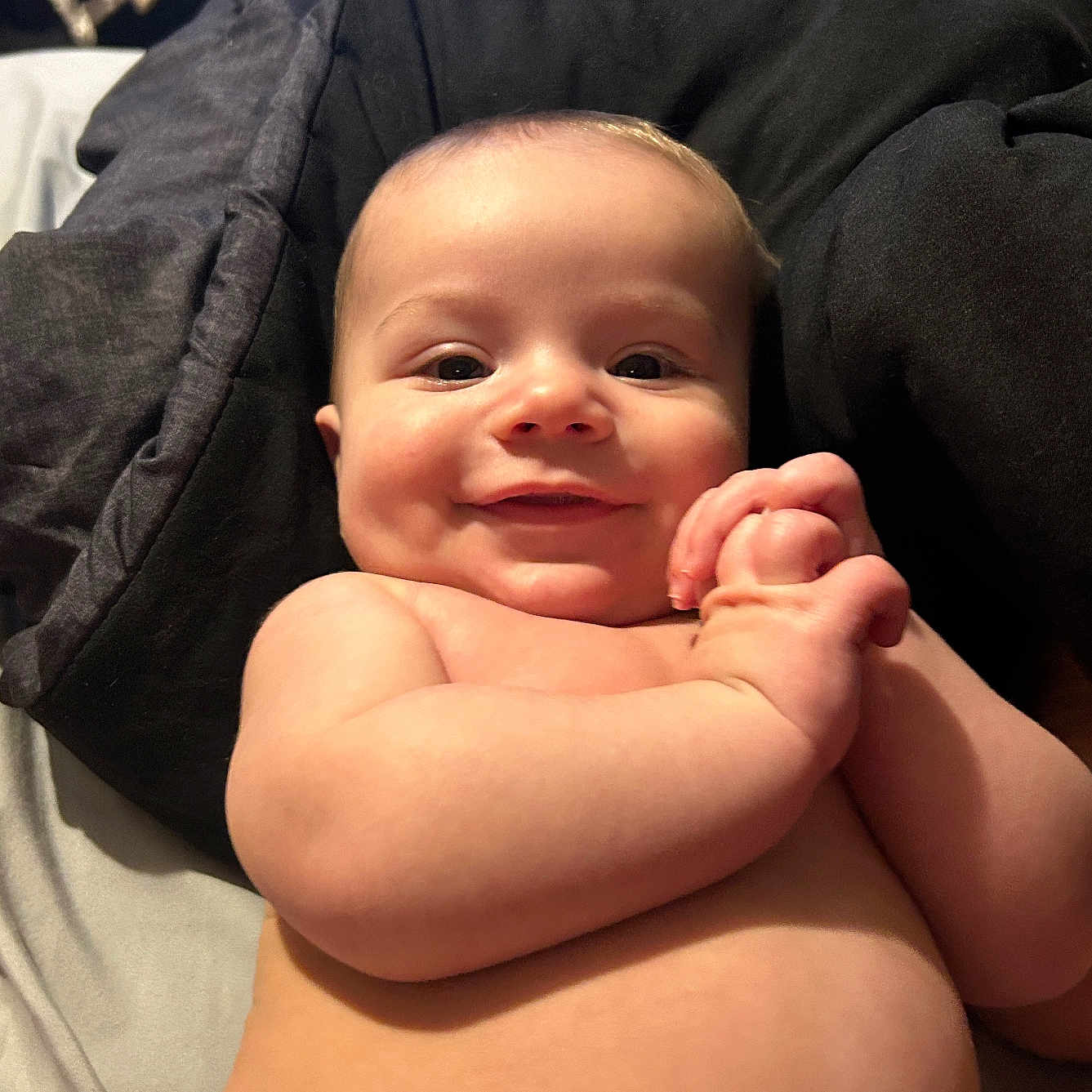 Kamryn joined the competition — help win amazing prizes! baby, bed, blanket, bodypart, clothing, cushion, diaper, face, finger, furniture, hand, happy, head, homedecor, newborn, pants, person, photography, portrait, smile