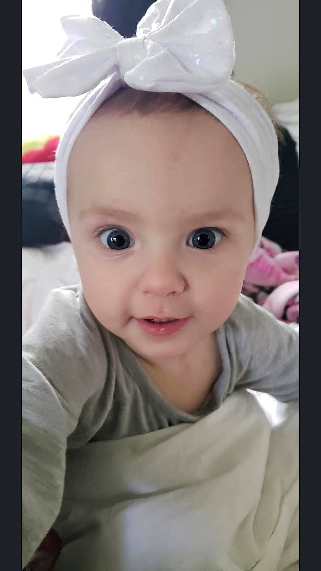 Vanessa is registered to the contest to win money with this photo: baby, beauty, cheek, child, chin, ear, eye, eyebrow, face, forehead, head, headgear, iris, lip, mouth, nose, person, pink, skin, smile