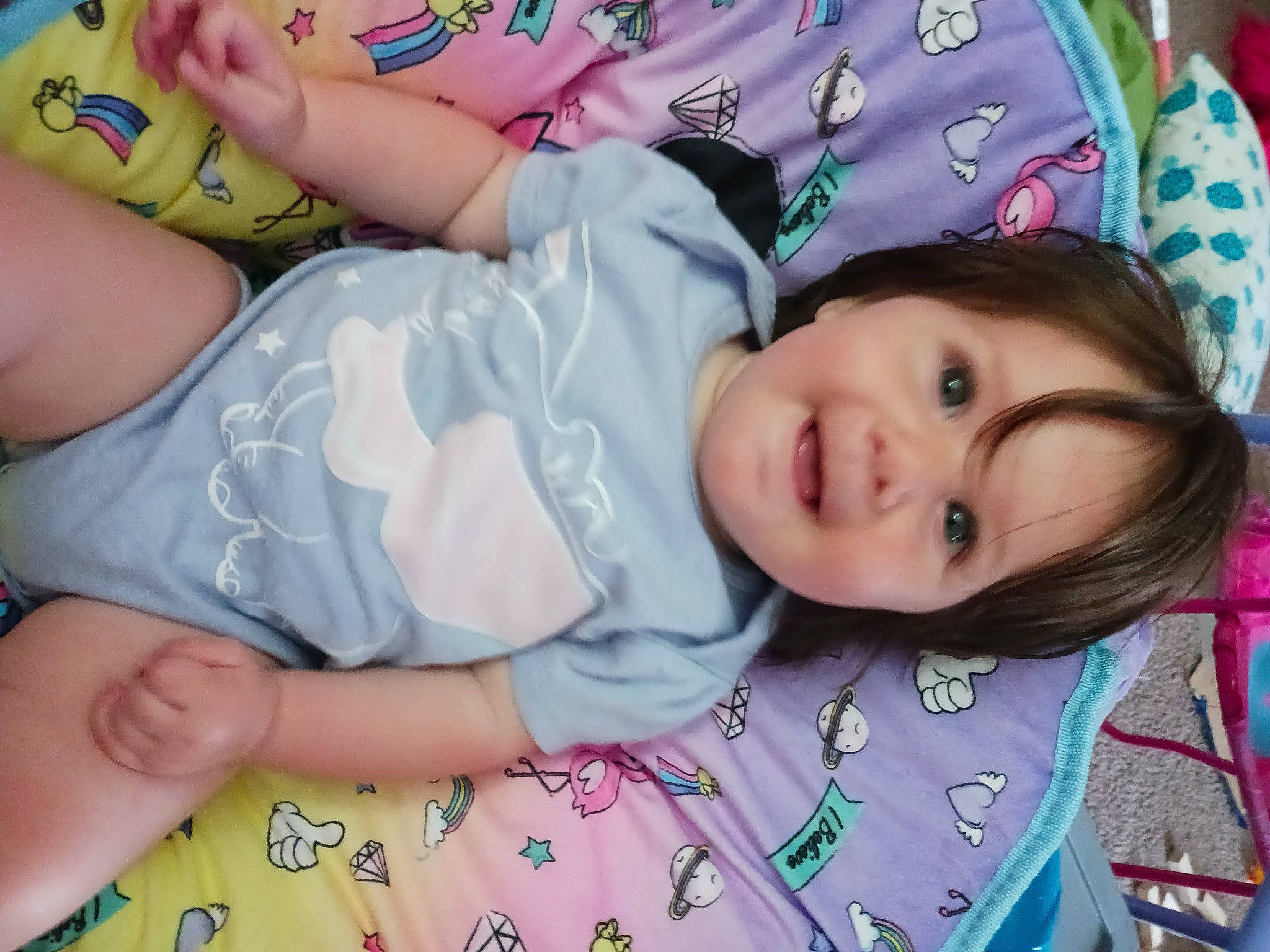 Dani is registered to the contest to win money with this photo: baby, baby_toddler_clothing, cheek, child, eyelash, fun, grass, happy, iris, lip, nail, nose, pattern, person, pink, portrait_photography, skin, sleeve, smile, thigh