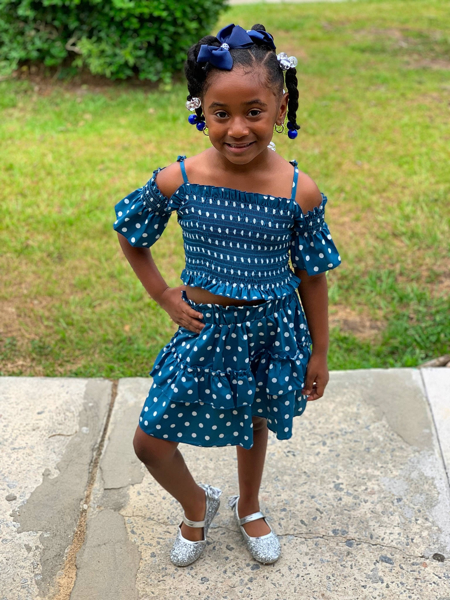 Jasiri is registered to the contest to win money with this photo: baby_toddler_clothing, child, day_dress, dress, electric_blue, eye, fun, grass, happy, head, human_leg, jewellery, joy, leisure, one_piece_garment, pattern, person, plant, public_space, smile