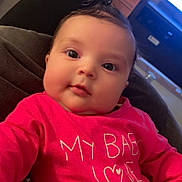 Diana a rejoint le concours — aidez-le/la à gagner de superbes lots ! baby, infant, child, portrait, pink_clothing, onesie, chubby_cheeks, hair_tie, closeup, eyes, cute, indoor, sofa, blanket, television, living_room, person, skin, smile, casual_photography