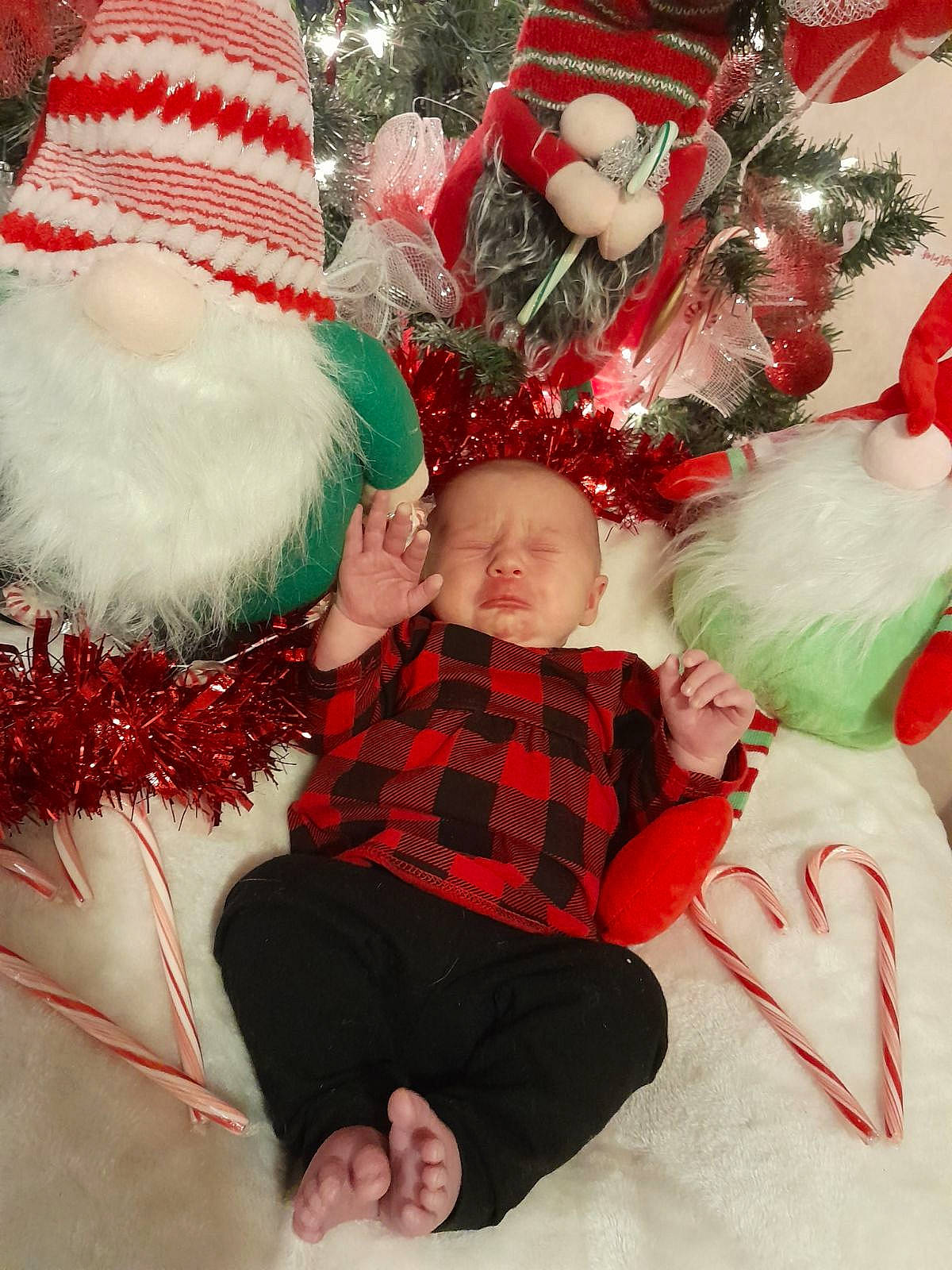 Layana joined the competition — help win amazing prizes! baby, baby_toddler_clothing, christmas, christmas_decoration, christmas_ornament, christmas_tree, comfort, event, fictional_character, happy, hat, head, holiday, holiday_ornament, human_body, lap, ornament, person, santa_claus, sleeve