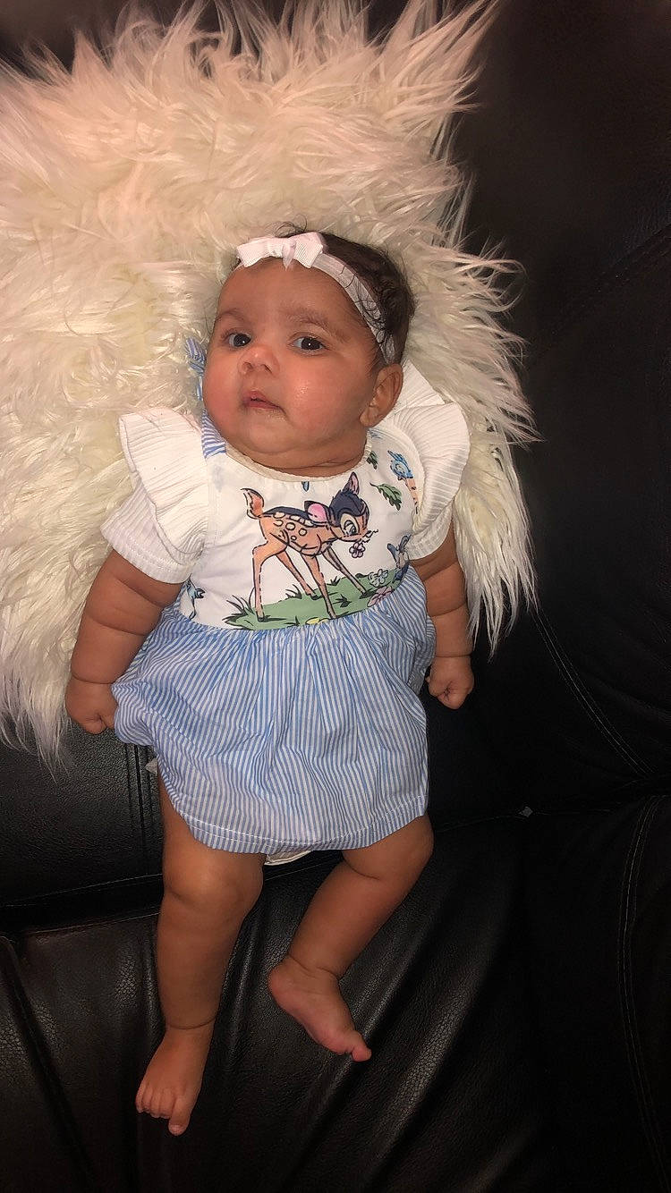 Amyra is registered to the contest to win money with this photo: baby, cheek, child, doll, eye, fun, hair_accessory, head, headpiece, iris, person, pink, product, skin, smile, toddler