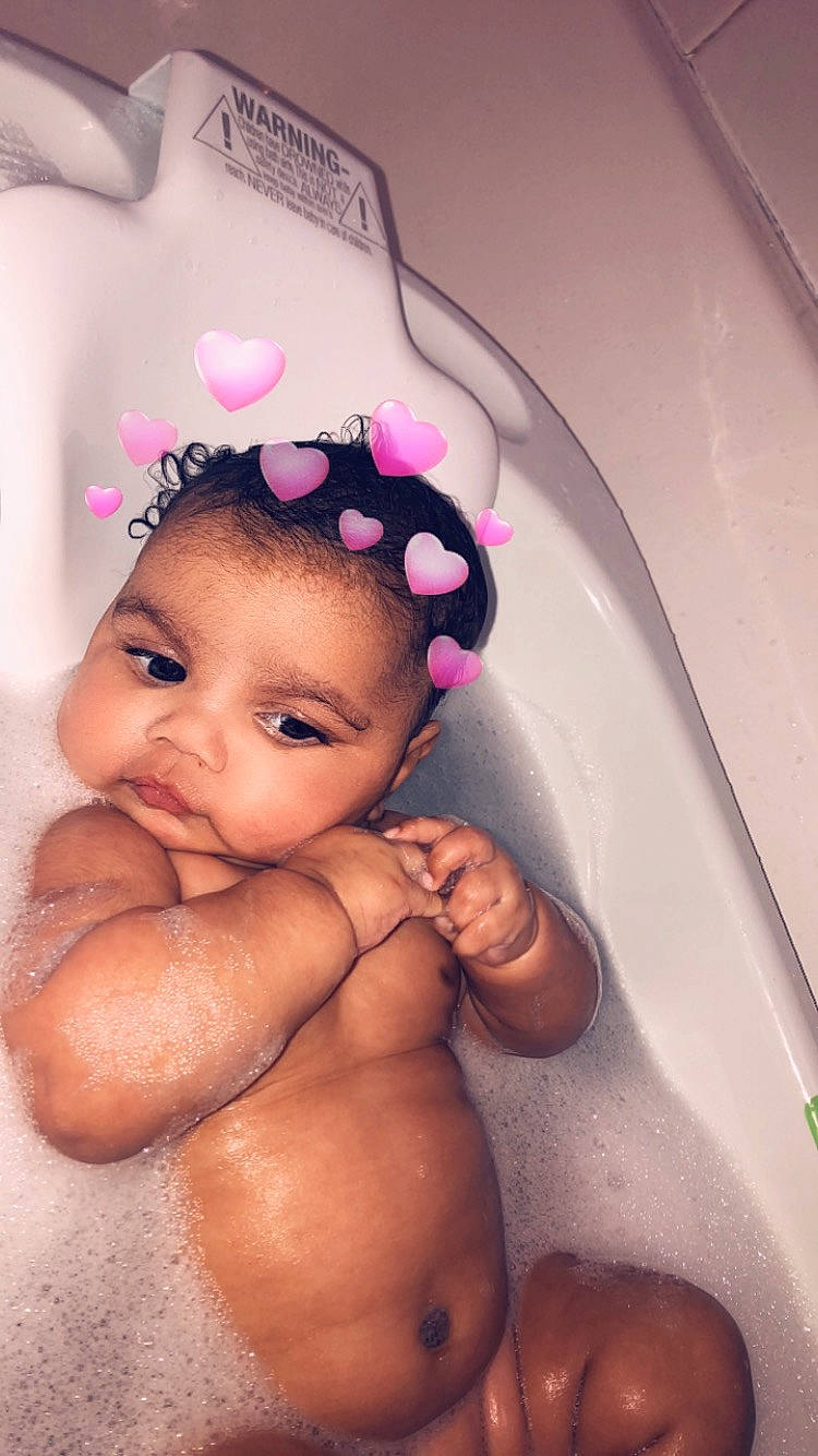 Amyra is registered to the contest to win money with this photo: baby, baby_bathing, bathing, bathtub, cheek, child, eyebrow, face, forehead, hair_accessory, hand, head, headband, headpiece, nose, person, photography, pink, skin, smile