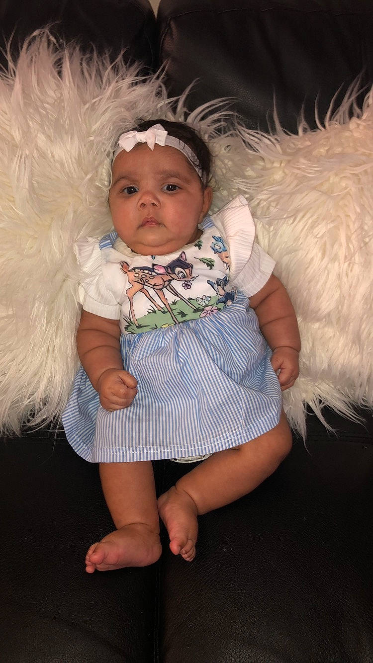 Amyra is registered to the contest to win money with this photo: baby, baby_products, cheek, child, dress, fun, fur, hair_accessory, headgear, headwear, leg, person, photography, product, skin, smile, toddler