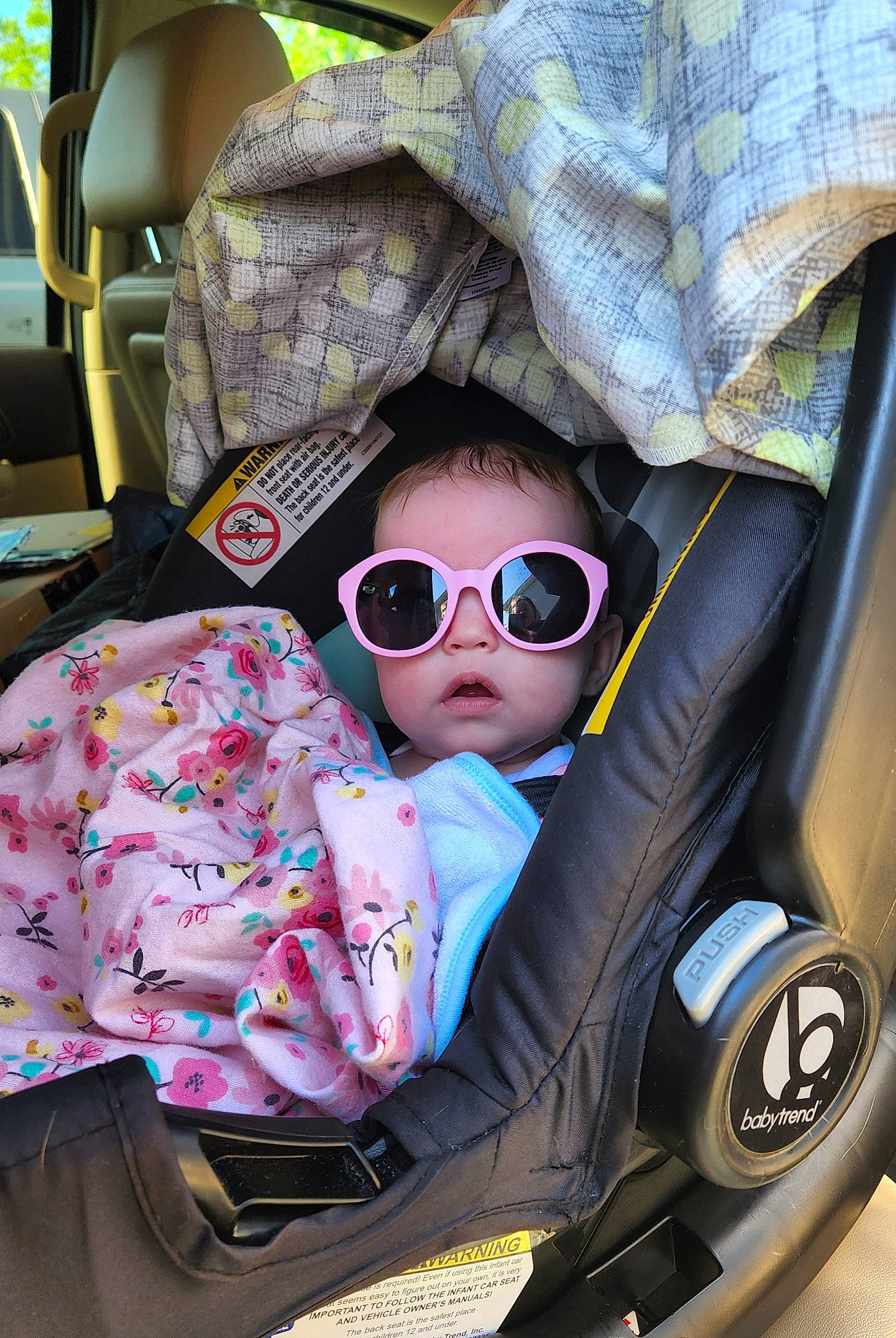 Parker is registered to the contest to win money with this photo: auto_part, baby, baby_carriage, baby_toddler_clothing, cap, car_seat, car_seat_cover, child, comfort, eyewear, glasses, goggles, headgear, motor_vehicle, people, person, personal_protective_equipment, product, sunglasses, toddler