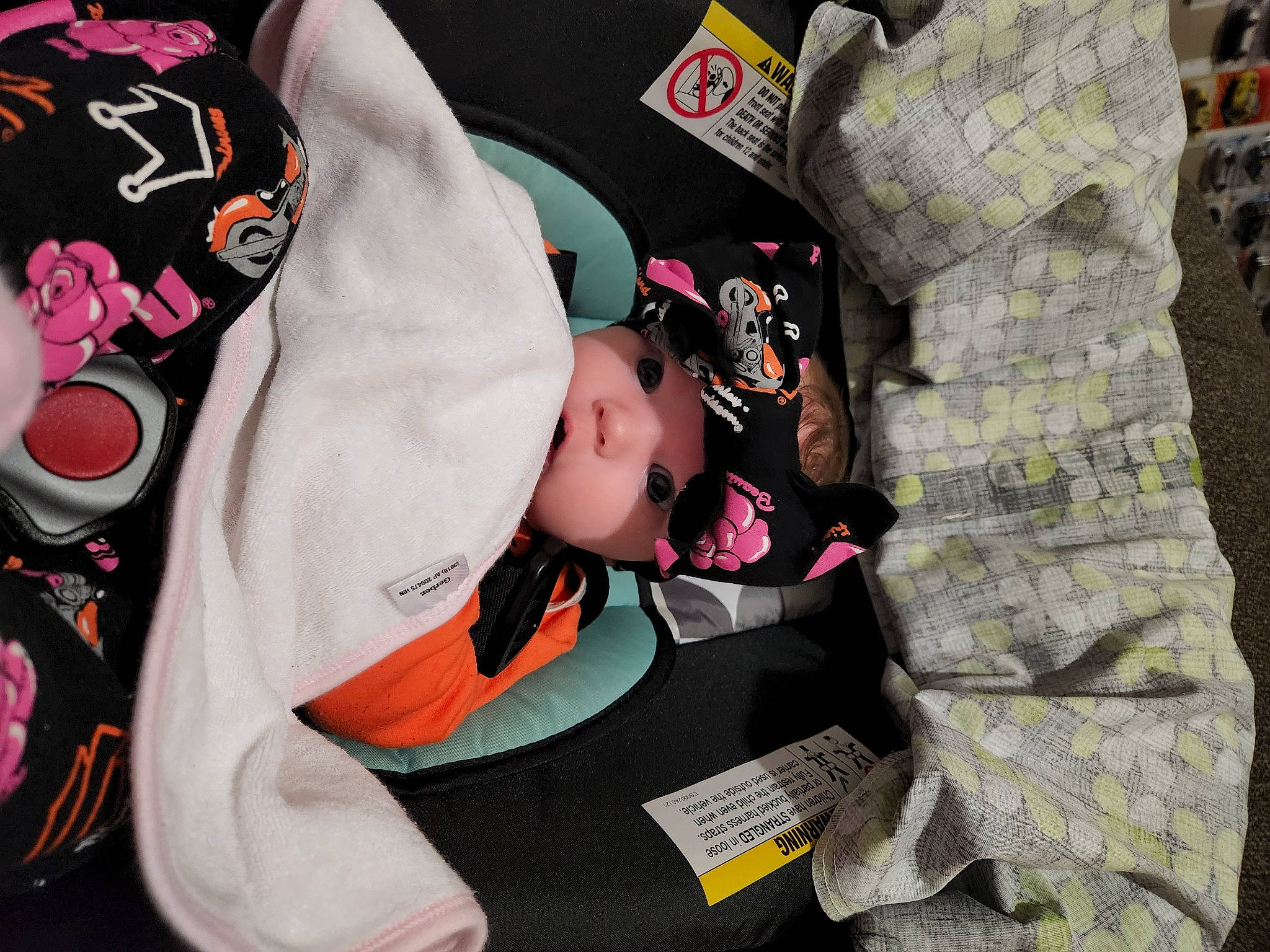 Parker is registered to the contest to win money with this photo: baby, baby_carriage, baby_products, baby_toddler_clothing, cap, carmine, child, costume, event, fictional_character, hat, headwear, outerwear, pattern, person, personal_protective_equipment, recreation, sleeve, t_shirt, toddler