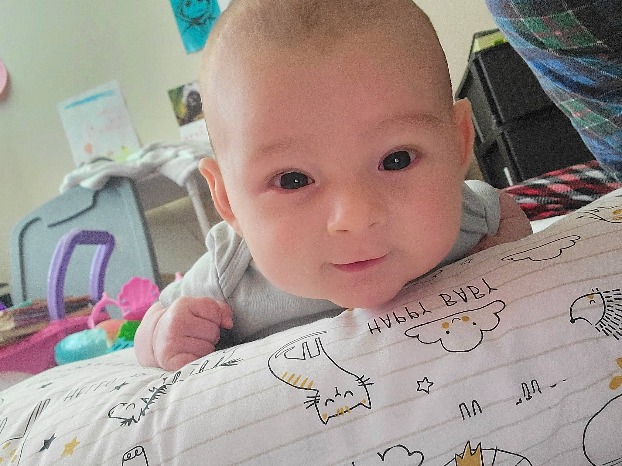 Gambit is registered to the contest to win money with this photo: baby, baby_products, baby_toddler_clothing, beauty, chair, cheek, child, eyelash, font, fun, happy, nose, number, pattern, person, room, sitting, skin, smile, toddler