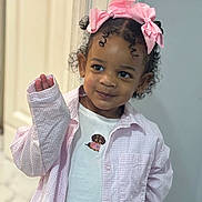 Amelia joined the competition — help win amazing prizes! child, clothing, curly_hair, cute, doorway, fashion, girl, home, indoor, jacket, pastel, photography, pink_bow, playful, portrait, shirt, smiling, standing, toddler, waving