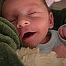 Gunner joined the competition — help win amazing prizes! baby, newborn, sleeping, blanket, face, infant, bottle, cup, cozy, soft, smile, child, cute, resting, indoors, closeup, peaceful, warm, comfort, portrait
