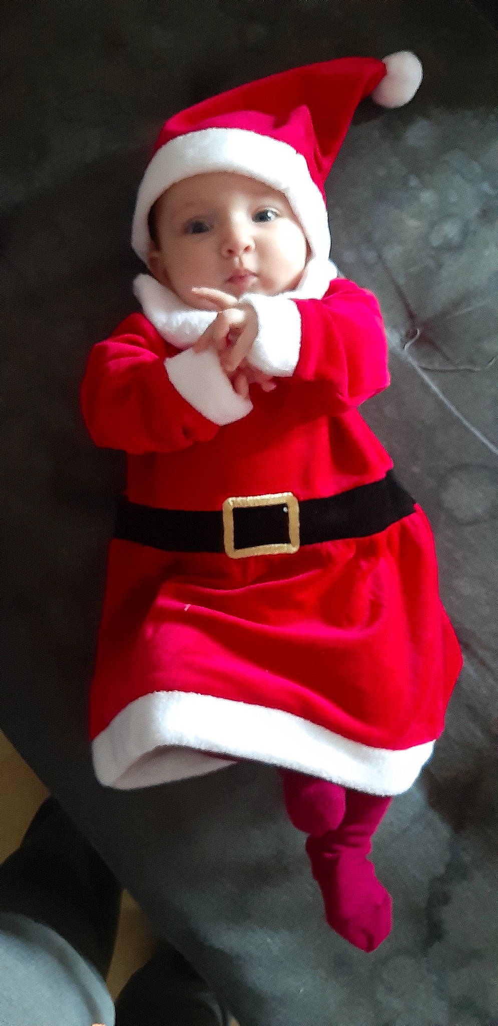 Selena participe au concours pour gagner de l'argent avec cette photo : child, christmas, costume, doll, fictional_character, person, red, santa_claus, smile, toddler