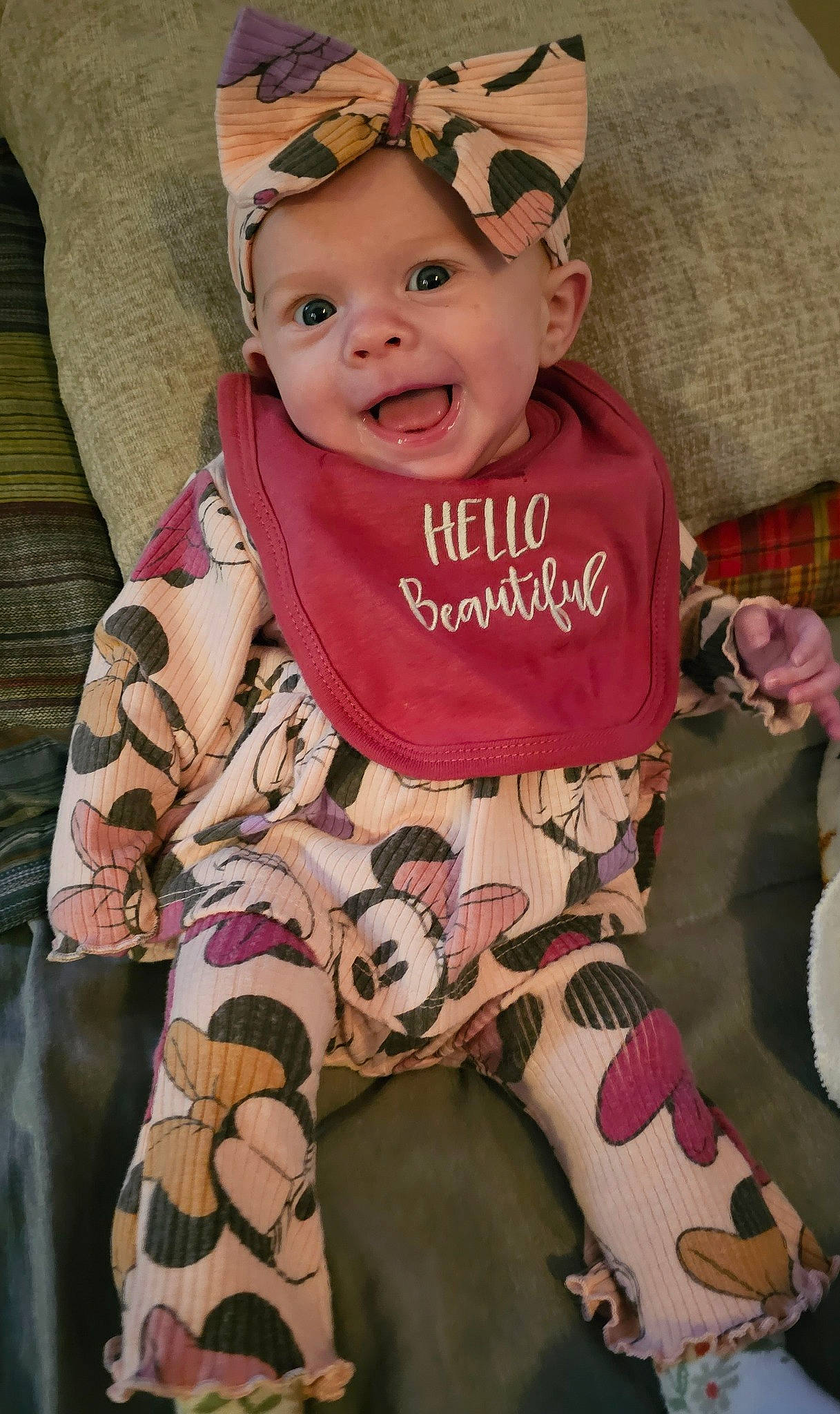 Alarra is registered to the contest to win money with this photo: baby, baby_toddler_clothing, cap, cheek, child, comfort, cool, eye, face, facial_expression, happy, head, headwear, human_body, mammal, pattern, person, pink, skin, sleeve