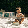 Austin joined the competition — help win amazing prizes! baby, birthday, cake, messy, blue_cake, outdoor, grass, greenery, blocks, one, smiling, happy, child, first_birthday, celebration, sitting, white_sheet, balloon, clothing, face