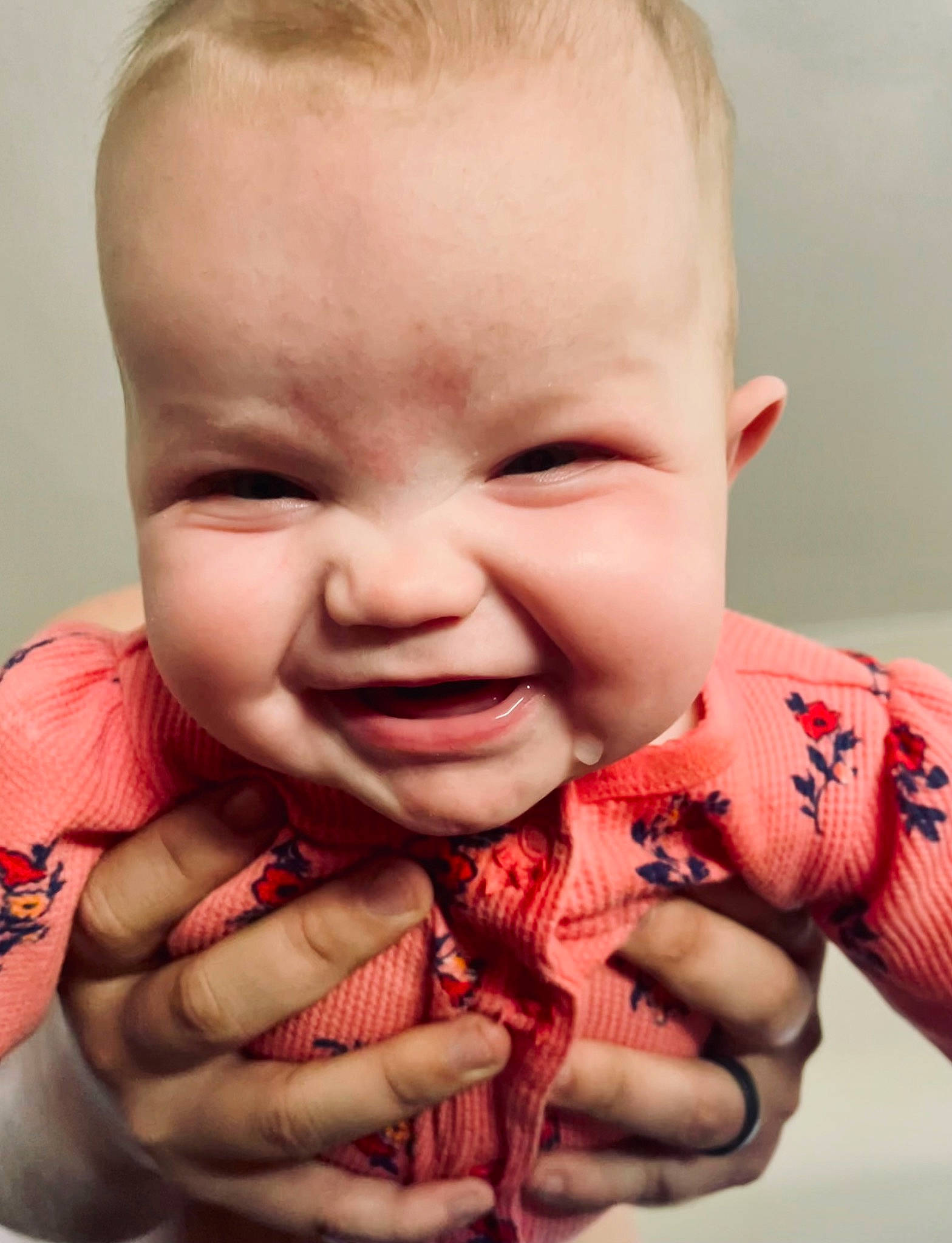 Adelaide is registered to the contest to win money with this photo: baby, baby_toddler_clothing, cheek, chin, ear, eyebrow, eyelash, finger, gesture, hand, happy, iris, joy, lip, mouth, nose, organ, person, pink, skin