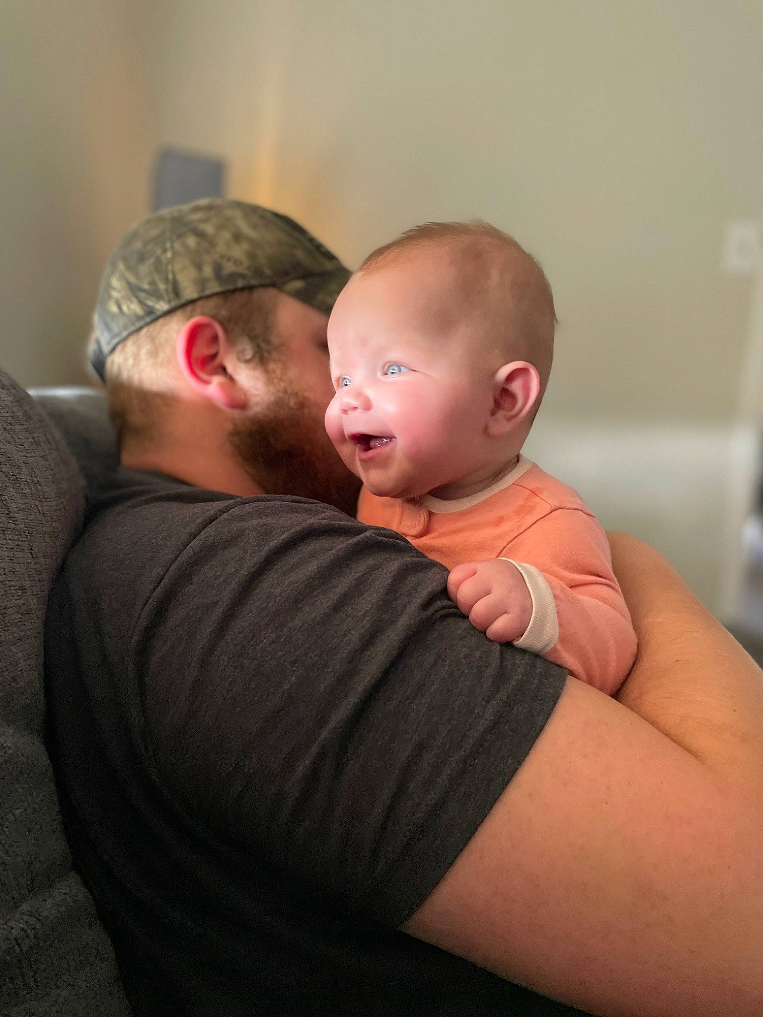 Adelaide is registered to the contest to win money with this photo: abdomen, baby, beard, cheek, chest, child, comfort, ear, elbow, fun, gesture, happy, joint, neck, person, shoulder, sitting, stomach, t_shirt, toddler