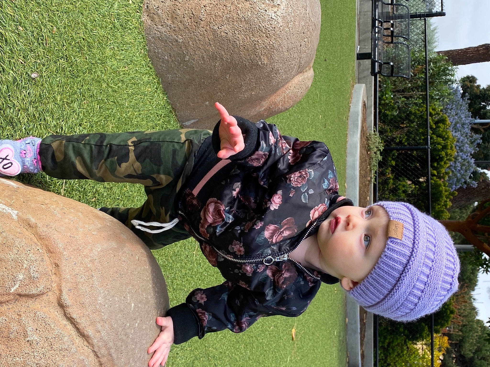 Adrianna joined the competition — help win amazing prizes! child, fun, garden, grass, green, happy, hat, headwear, human_leg, leisure, military_camouflage, pattern, people_in_nature, person, plant, recreation, sitting, soil, spring, sun_hat