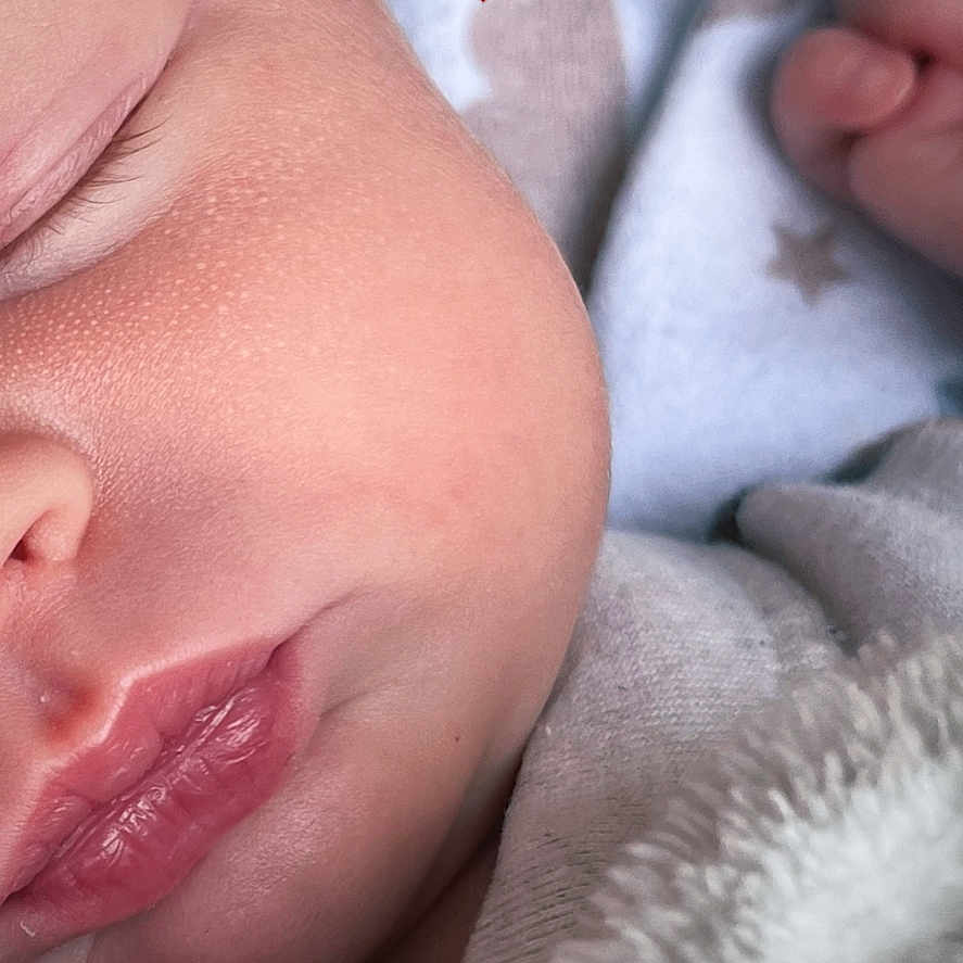 Lottie is registered to the contest to win money with this photo: baby, blanket, close_up, cozy, cute, eyelashes, face, fingers, hand, heart_emoji, infant, lips, newborn, nose, peaceful, rest, skin, sleeping, soft, warm