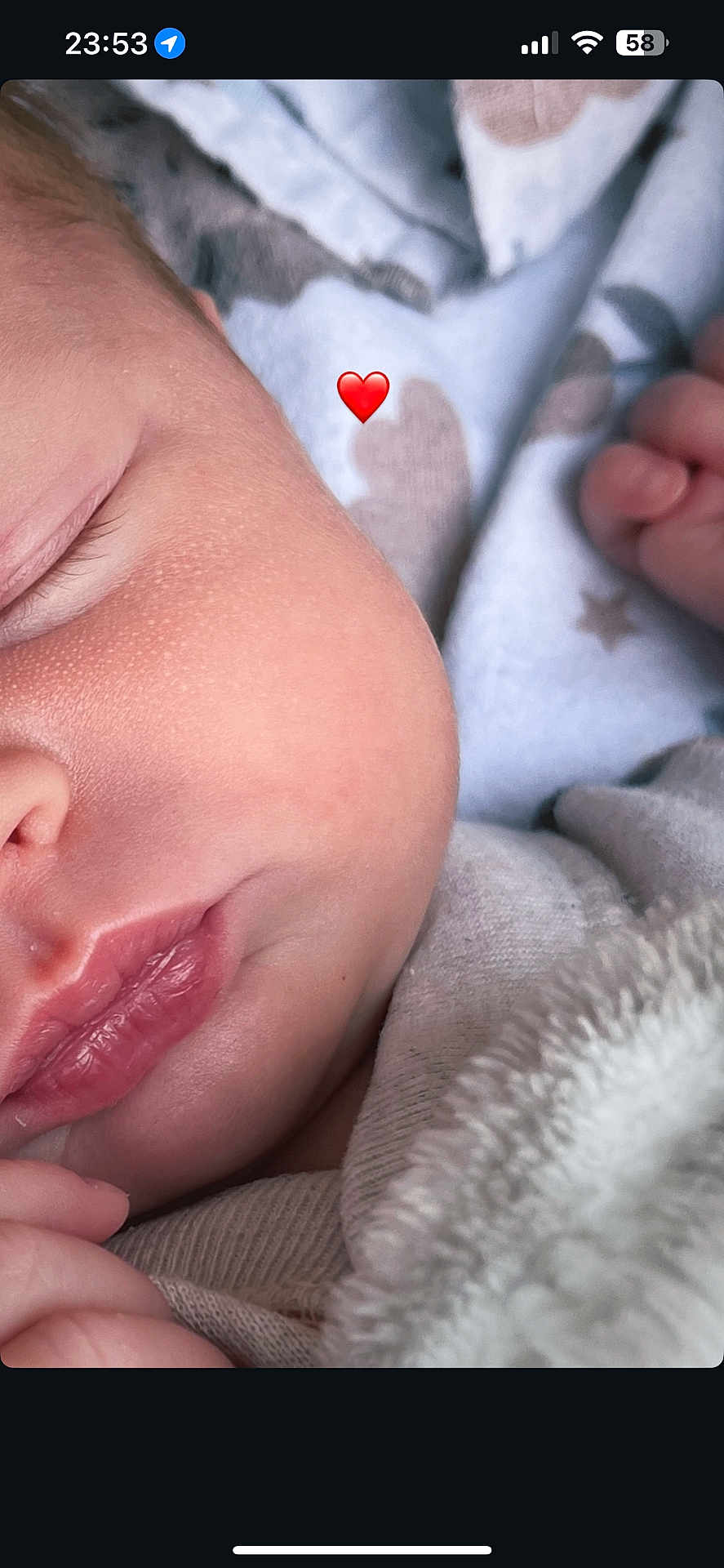 Lottie is registered to the contest to win money with this photo: baby, sleeping, close_up, face, skin, blanket, hand, peaceful, infant, newborn, cozy, soft, cute, lips, nose, eyelashes, fingers, warm, rest, heart_emoji