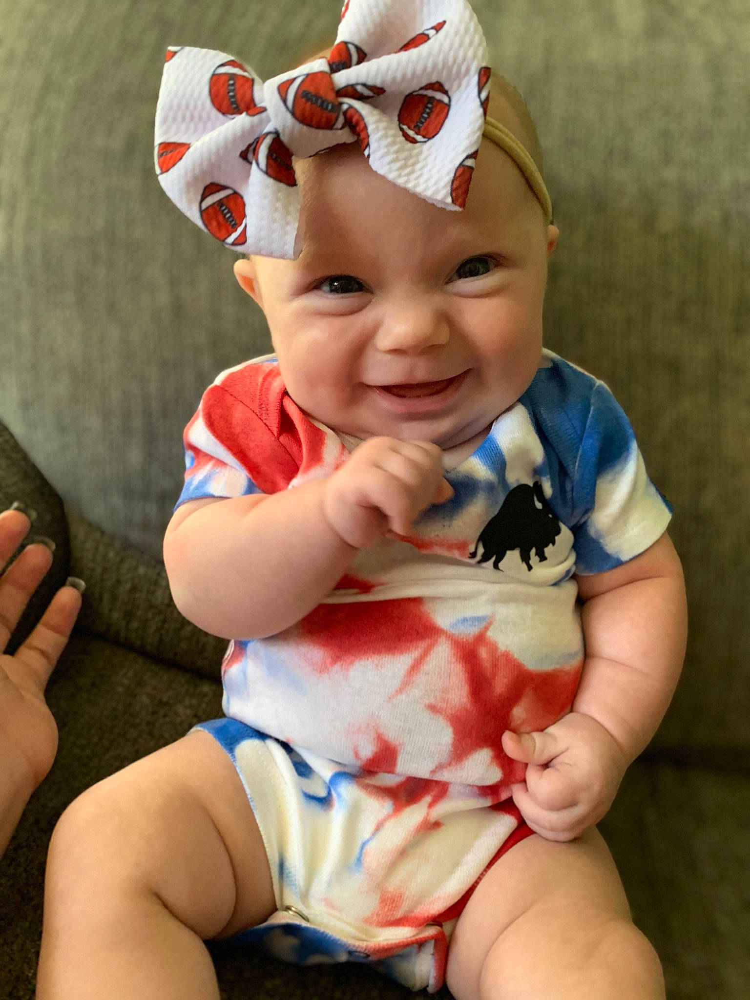 Sophia is registered to the contest to win money with this photo: baby, baby_toddler_clothing, cap, cheek, child, eye, finger, fun, happy, head, headwear, human_body, human_leg, lip, person, pink, skin, sleeve, smile, thigh