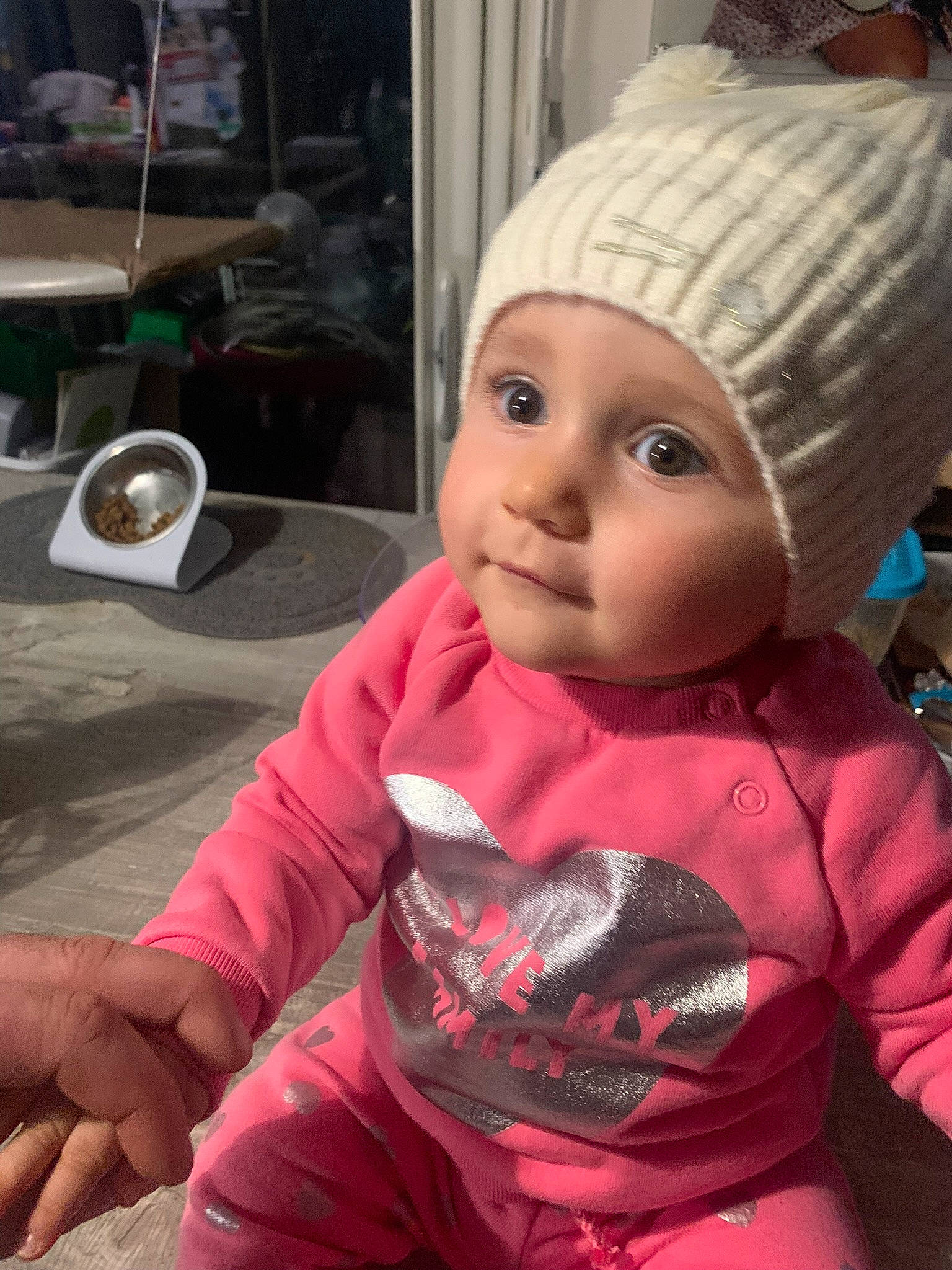 Maddy participe au concours pour gagner de l'argent avec cette photo : baby_toddler_clothing, beanie, cap, cheek, child, cool, doll, fashion_accessory, fun, hat, headwear, knit_cap, magenta, person, pink, sitting, sleeve, tableware, toddler, toy