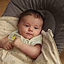 baby, baby_bed, blanket, child, clothing, comfort, cushion, cute, face, indoors, infant, newborn, person, portrait, relax, rest, sleeping_bag, smile, soft, young