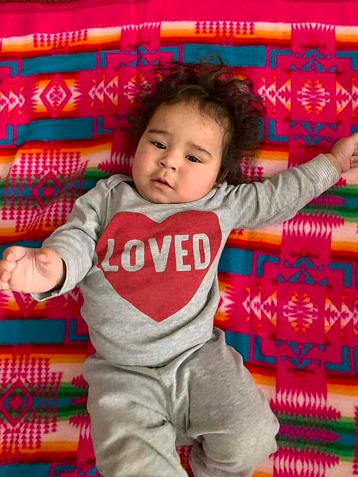 Heaven is registered to the contest to win money with this photo: baby, baby_toddler_clothing, beauty, child, eye, facial_expression, font, fun, happy, magenta, pattern, people, person, pink, play, product, red, sitting, sleeve, t_shirt