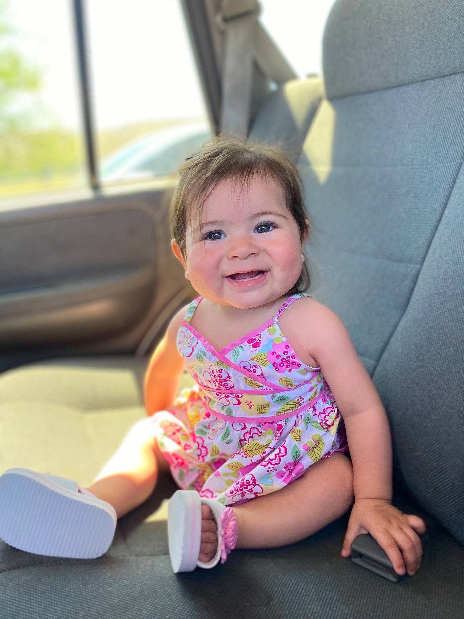 Sapphire is registered to the contest to win money with this photo: arm, baby, baby_toddler_clothing, child, comfort, face, facial_expression, finger, fun, happy, joy, leg, leisure, person, pink, recreation, shoe, skin, smile, sock