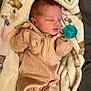 baby, sleeping, blanket, onesie, pacifier, infant, soft, cozy, cute, child, face, peaceful, rest, comfort, newborn, clothing, lying_down, bed, portrait, warm