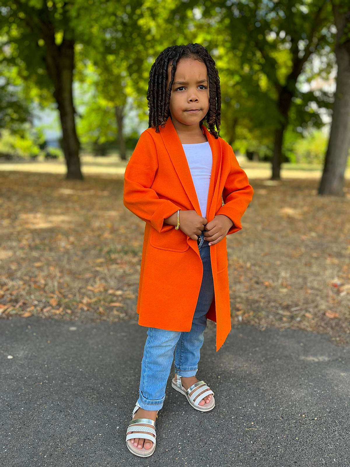 Ayanah a rejoint le concours — aidez-le/la à gagner de superbes lots ! asphalt, denim, electric_blue, eye, face, footwear, hair, happy, head, jacket, leisure, long_hair, neck, orange, people_in_nature, person, recreation, shoe, sleeve, toddler