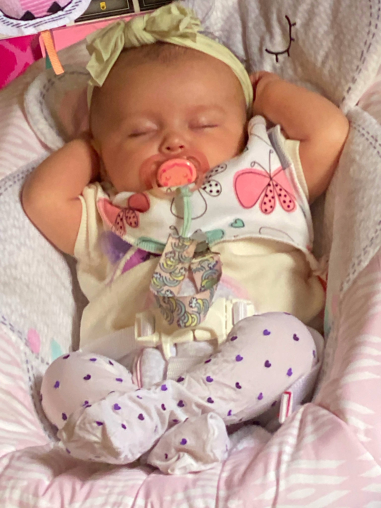 Addie joined the competition — help win amazing prizes! baby, baby_products, baby_sleeping, baby_toddler_clothing, cheek, child, comfort, event, face, facial_expression, happy, head, linens, pattern, person, pink, skin, sleeve, textile, toddler