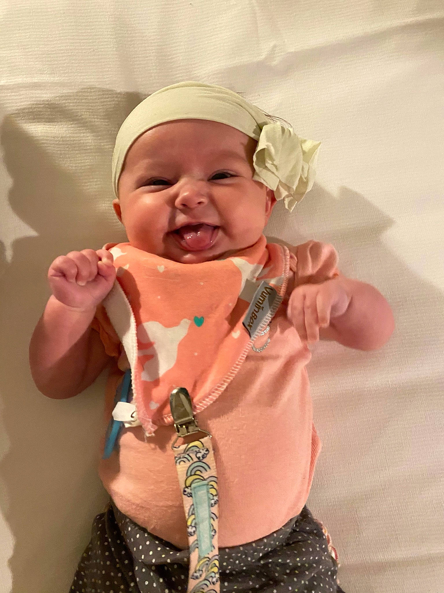 Addie joined the competition — help win amazing prizes! arm, baby, baby_toddler_clothing, cheek, chin, dress, eye, eyebrow, face, gesture, happy, head, headwear, iris, lip, mouth, nose, person, skin, sleeve