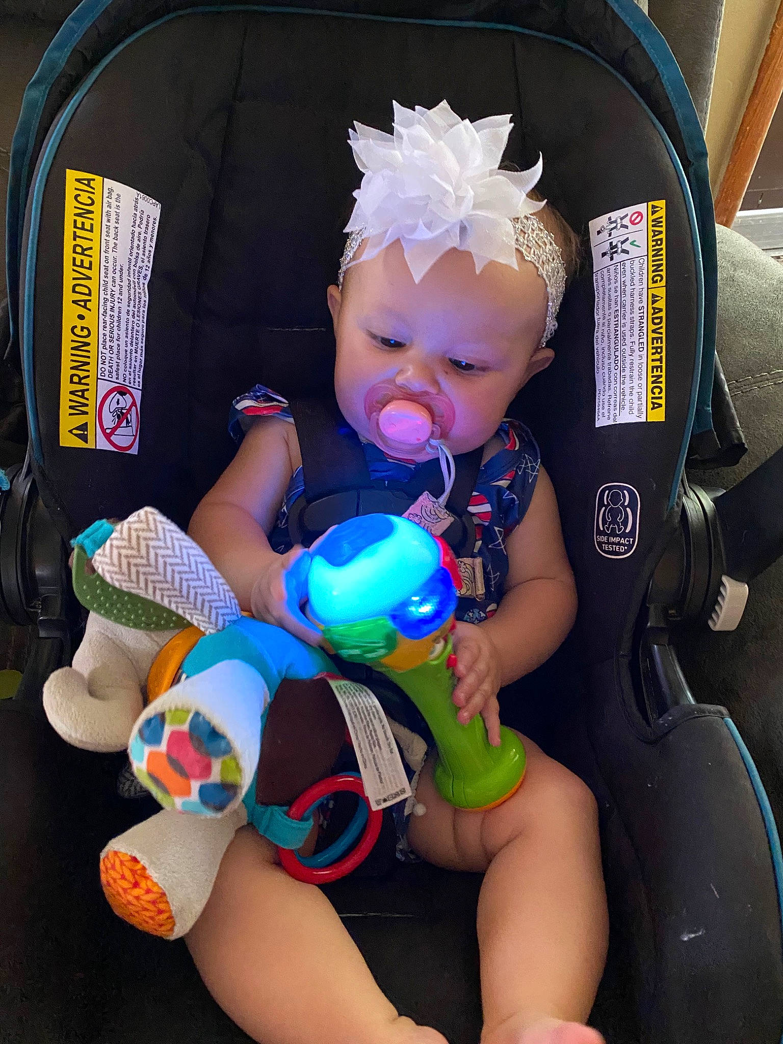 Addie is registered to the contest to win money with this photo: auto_part, baby, baby_carriage, baby_products, baby_safety, baby_toddler_clothing, car_seat, car_seat_cover, chair, cheek, child, comfort, electric_blue, finger, human_leg, person, product, thigh, thumb, toddler